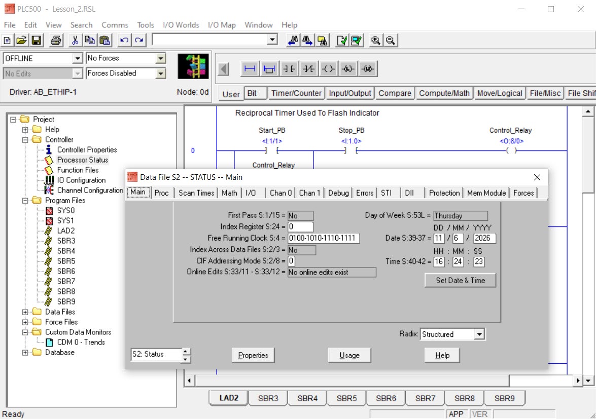 PLCLogix 500 Processor Status window open over the ladder program